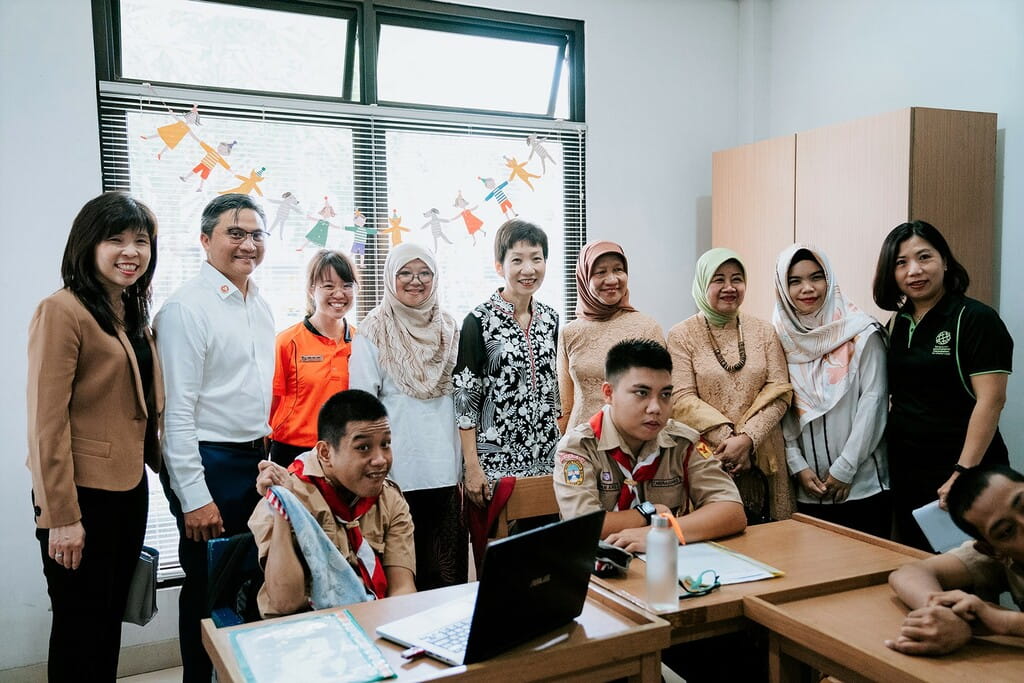 Minister for Culture, Community and Youth, Ms Grace Fu (standing, centre) and Members of Parliament Ms Jessica Tan and Mr Saktiandi Supaat (standing, first and second from left) also visited the SIF's project in Jakarta, Indonesia to observe classroom teachings in occupational therapy led by SIV, Ms Png Hui Jun (in orange). 