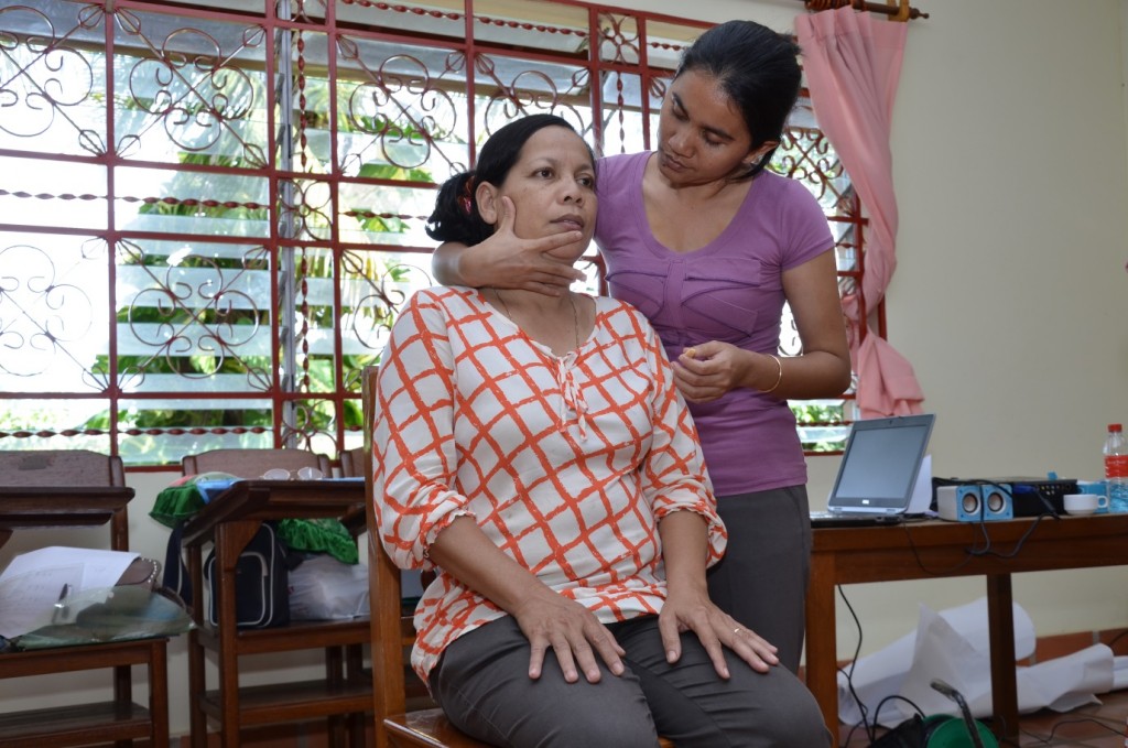 Practising techniques to train others to help children with feeding and communication problems.