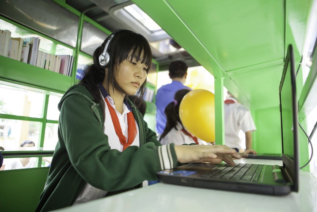 Student at Le Minh Xuan Secondary School using the Internet on the mobile library.