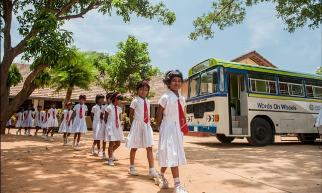 Some of the 3,000 Jaffna youths expected to benefit from the project are waiting to explore the mobile library stocked with English reading material, part of our initiative to raise their competency in English.