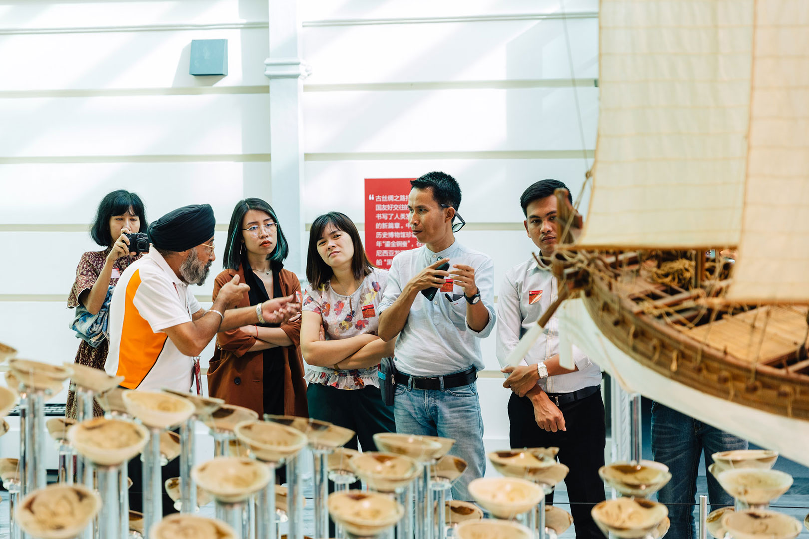 Southeast Asia is highly connected region, Docent Bhajan Singh (second from left) explains how the diversities within our countries come together at the Asian Civilisation Museum, such as through its maritime history. 