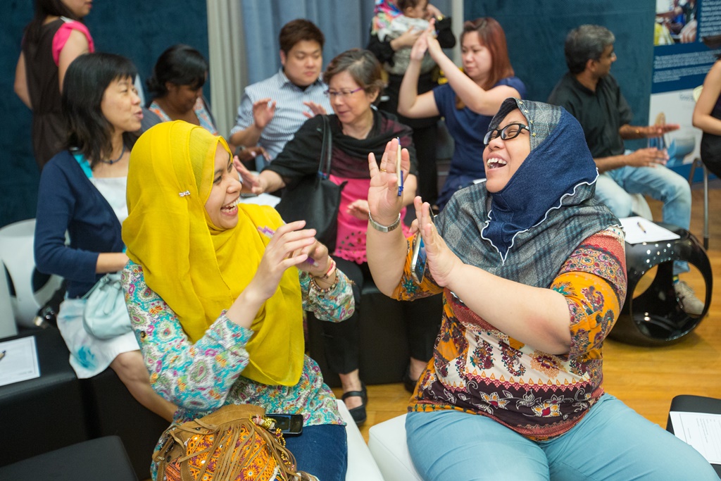 Giving fellow participants high-fives for an enjoyable, engaging evening of storytelling.