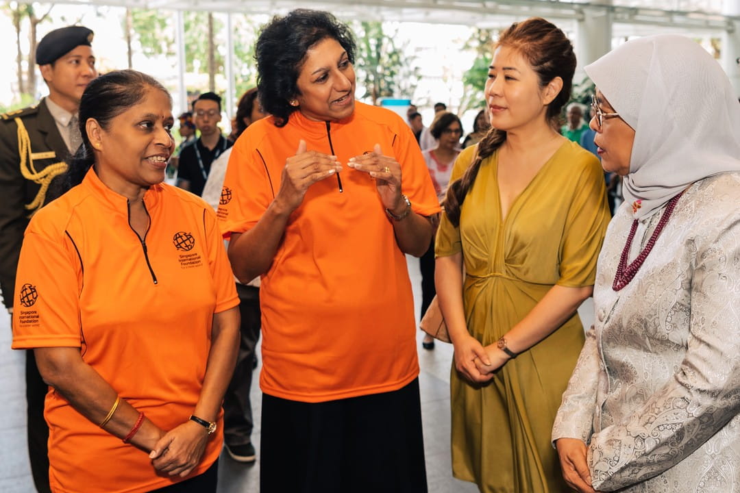 President Halimah toured the Bazaar's multimedia exhibition which was zoned by five focus areas of the SIF's work.