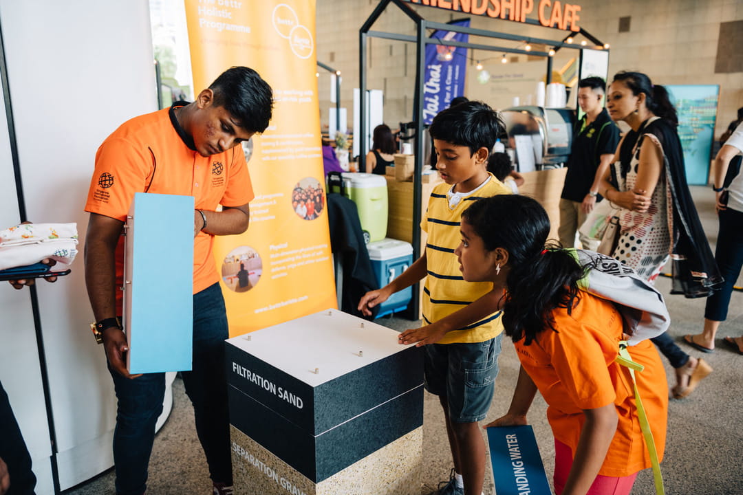 Citizen Ambassadors, such as this student, who have been on the SIF's Water for Life programme in Cambodia explained to members of the public how Bio-Sand Filters - a key part of the clean water programme - works. 