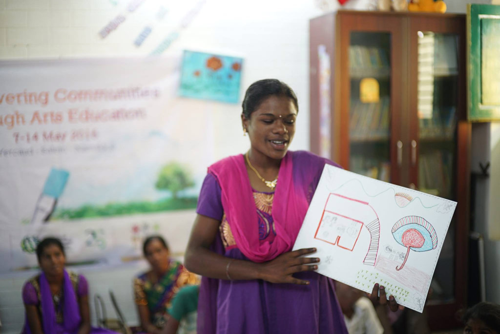 Member from the local community affected by HIV sharing insights to her life through her painting during the “Empowering Communities through Arts Education” programme.