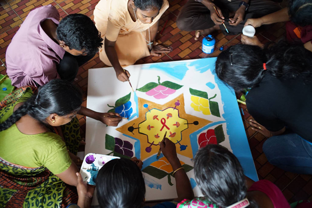 Workshop participants share insights to India through the painting of the Kolam.