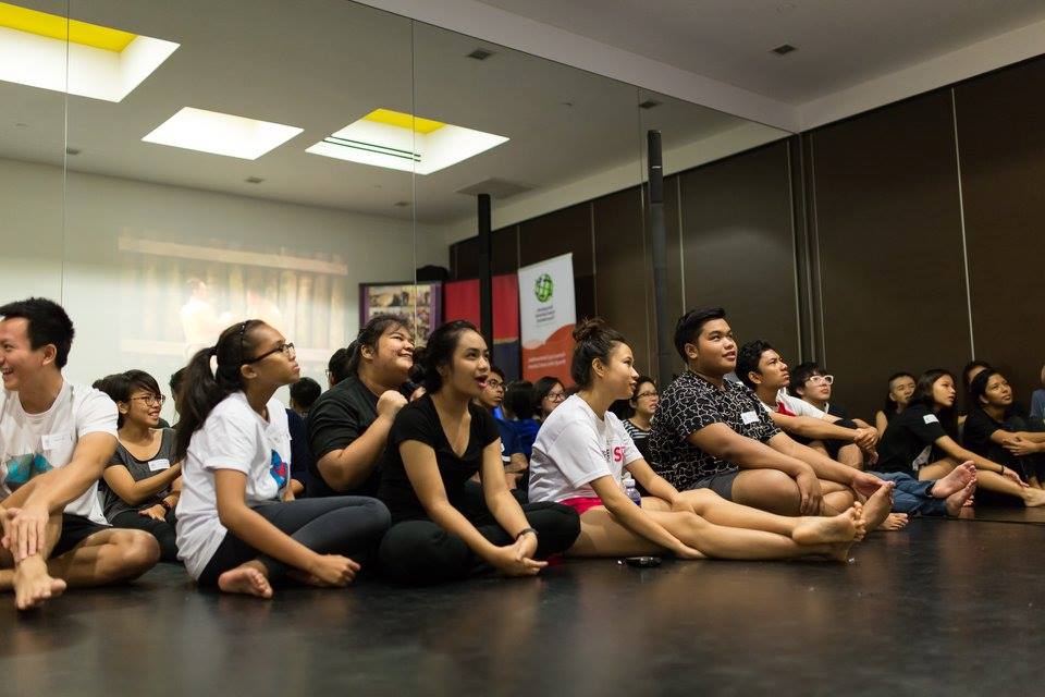 Students of 10 Square @ Orchard Central watching a compilation of Muay Thai scenes in Thai movies.