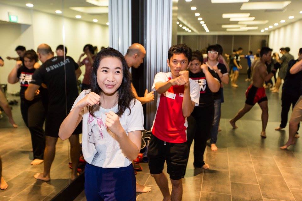 Thai and Singaporean students picking up Muay Thai moves from the volunteer trainers and students from the NTU Mixed Martial Arts Club.