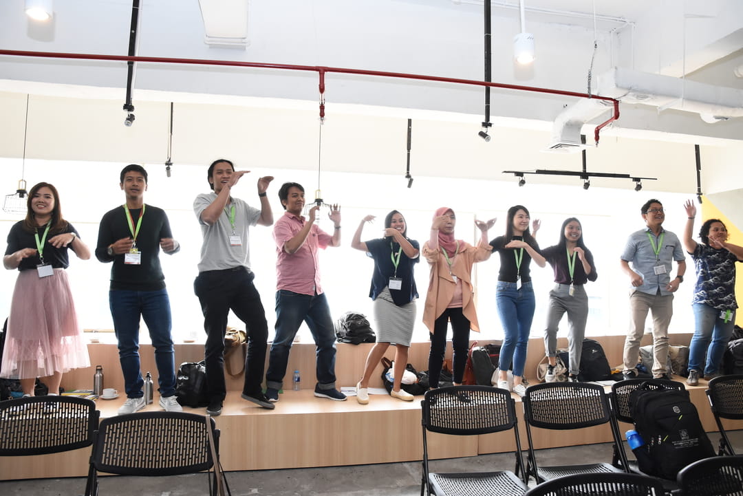 Learning makes your mind - and body - move! Participants who lost in a group activity had to perform a fun dance routine for their peers!