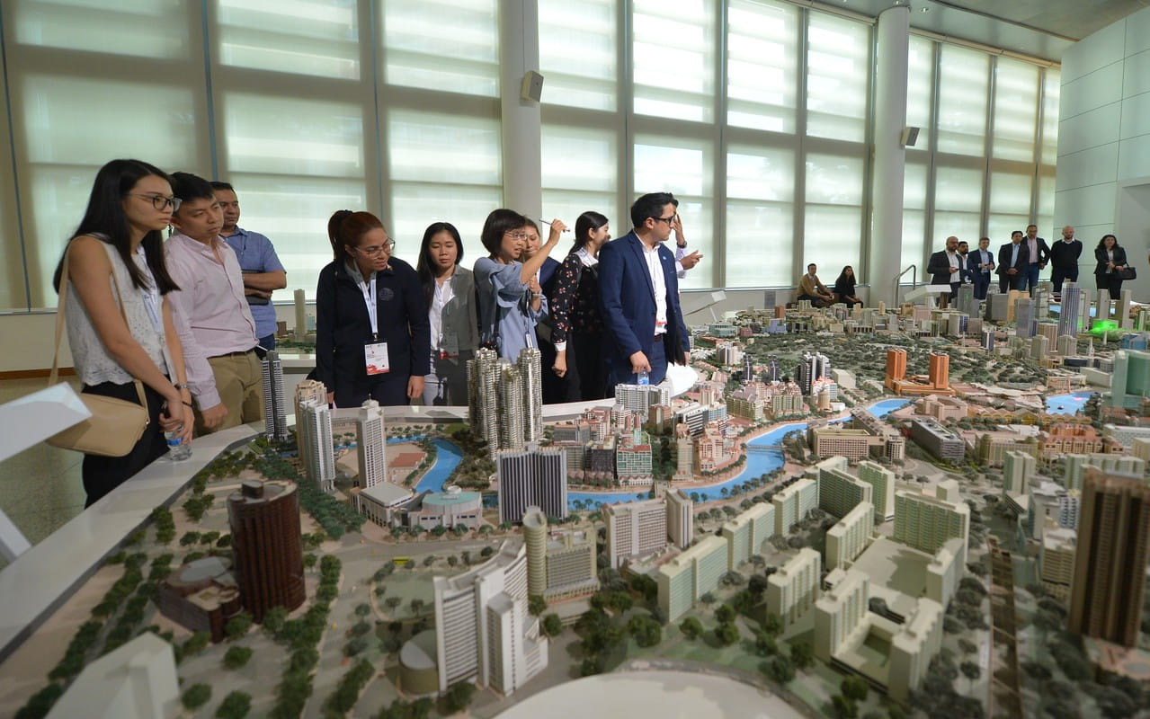 ASEAN Youth Fellows learning about Singapore's urban planning during their visit to the Urban Redevelopment Authority of Singapore (URA). 