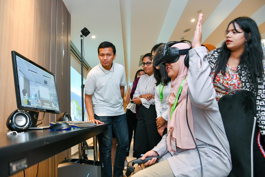 International participants from the study visit immerse in an interactive Virtual Reality (VR) experience curated by Cognitive Leap, a precision healthcare company which utilises VR and Artificial Intelligence to address mental health issues.