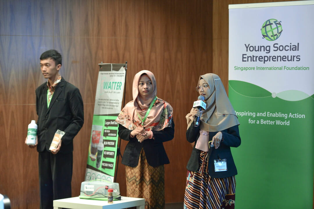 Indonesian participants (from left) Bagas Rohmatulloh, Ulfatu Mahmudda and Aurora Kartika from WATTER describe how the zero-waste animal feed and fertiliser they produce from soybean waste helps to increase farm yield at lower costs.