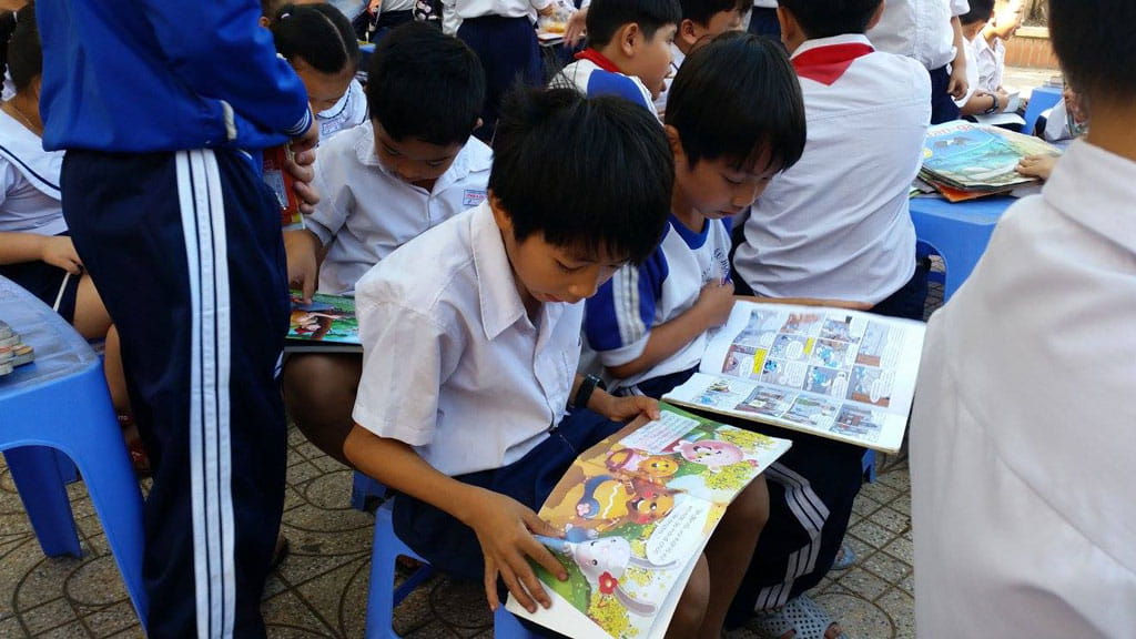  Children enjoying books from our Words on Wheels mobile library.