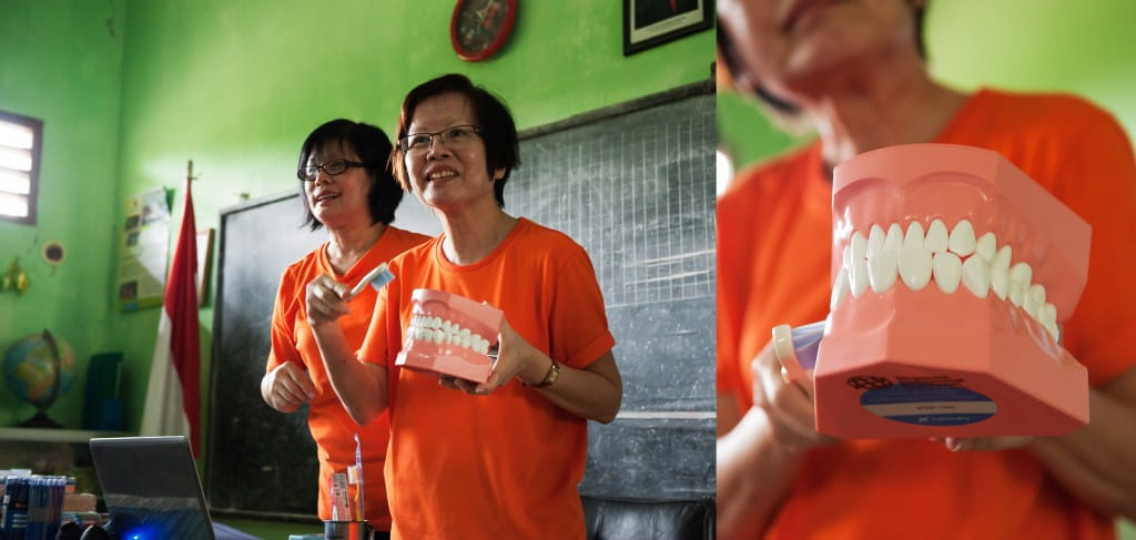 With a large model of the human teeth, SIV Lee Soi Moi (right) and Velda Lee demonstrated the effective brushing motions to better care for the teeth and gums. Students were asked to imitate the brushing movements on their clenched fists, which served as a makeshift teeth model for them to act on.