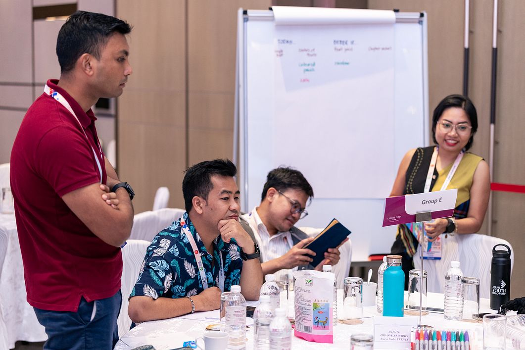 Reuban Manokara (far left) and Lara Jean Lupenario Salaysay (far right) present their group’s collective vision for fostering inclusivity across the region during one of AYF 2025’s workshops.