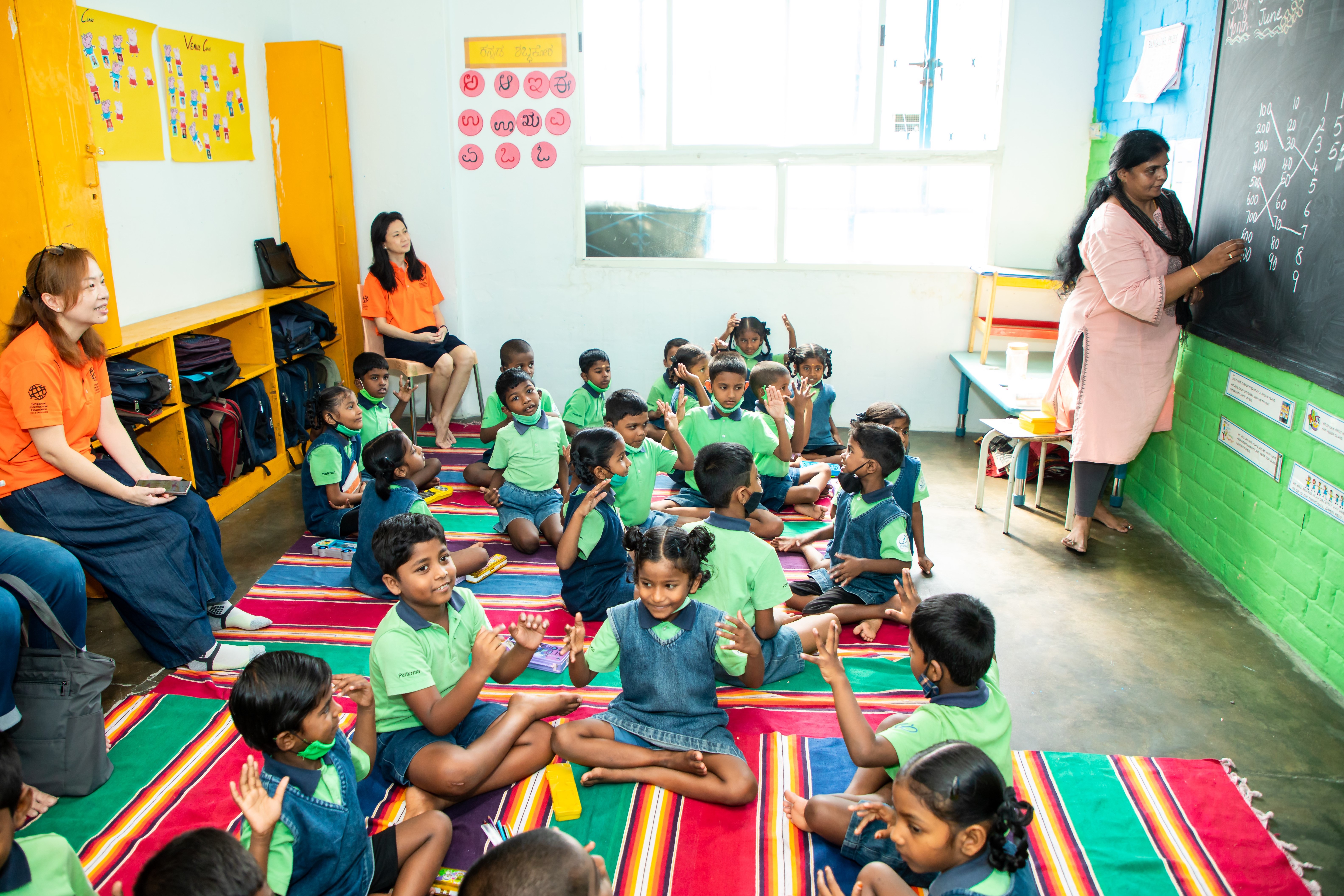 From left, SIVs Peggy Foo and Dr Ling Yuan (in orange) observing a Grade Two mathematics classroom lesson being conducted by Indian teacher Kavitha Anthony Juliyet.