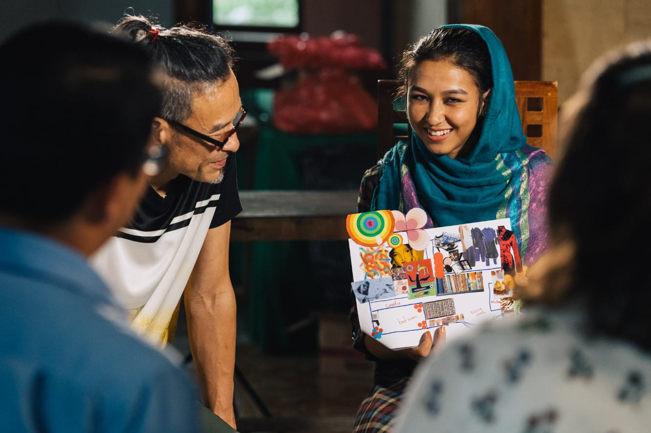 As part of the creative process, workshop participants like Zuhal Mohammadi (right) were tasked to make visual artworks of what home meant to them. These personal stories and perspectives gleaned through the sharing were incorporated into the final music performances.