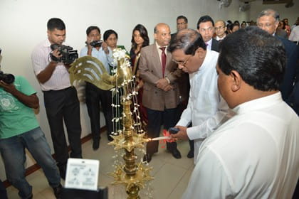 Minister of Health, Sri Lanka, Mr Maithripala Sirisena, Minister of Higher Education, Sri Lanka, Mr S.B. Dissanayake and officials from participating organisations take part in the traditional lamp lighting ceremony.