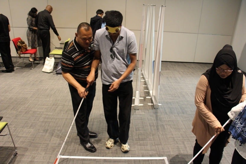 Our journalists experiencing a simulation session with visually impaired guides from Etch Empathy, a social enterprise that plants seeds of empathy in others through realistic experiences at the Enabling Village.