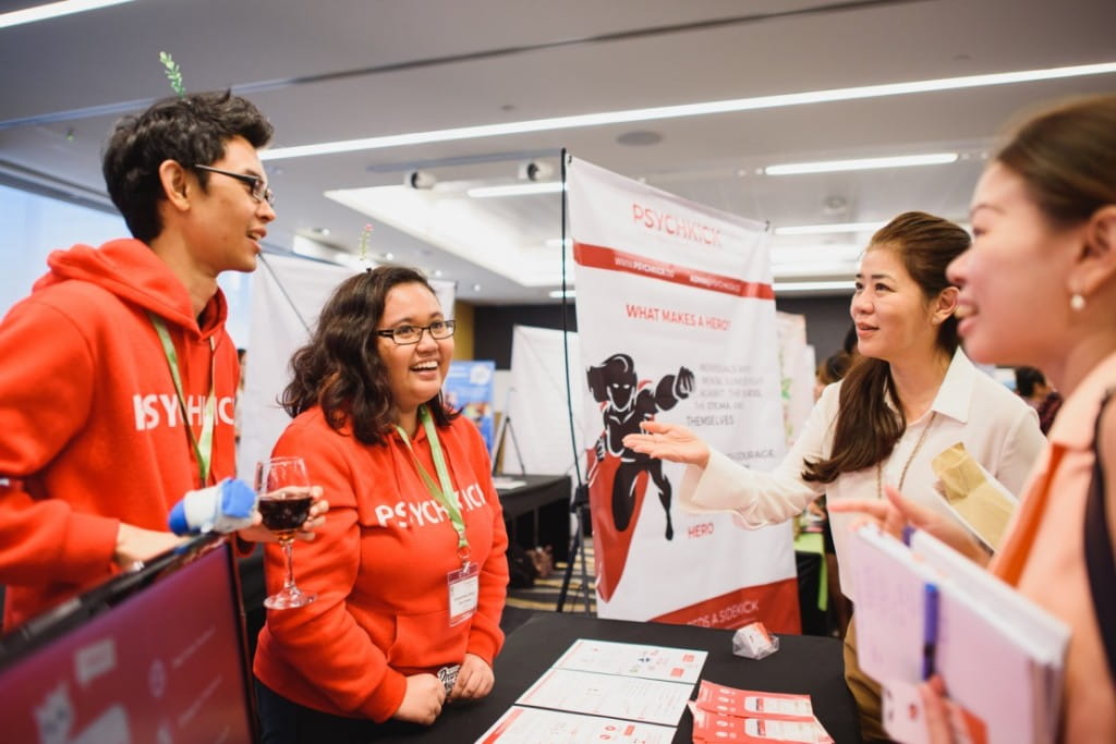 (From left) Sayid Hafiz Bin Sayid Zin and Shafiqah Nurul Afiqah Binte Ramani from PsychKick, a team from Singapore, sharing their innovative business model on using a mobile application to assist patients and psychotherapists in their treatment processes.