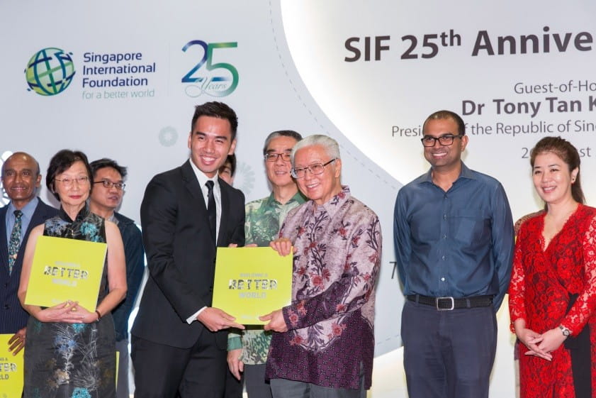Our citizen ambassador and Young Social Entrepreneurs programme alumnus Justine Lee from Soule, presenting SIF Patron and President of Singapore Dr Tony Tan our 25th Anniversary commemorative book titled Building a Better World.