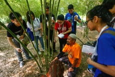 Engaging a local Klang villager in a social innovation project on sustainable composting for a bamboo forest.