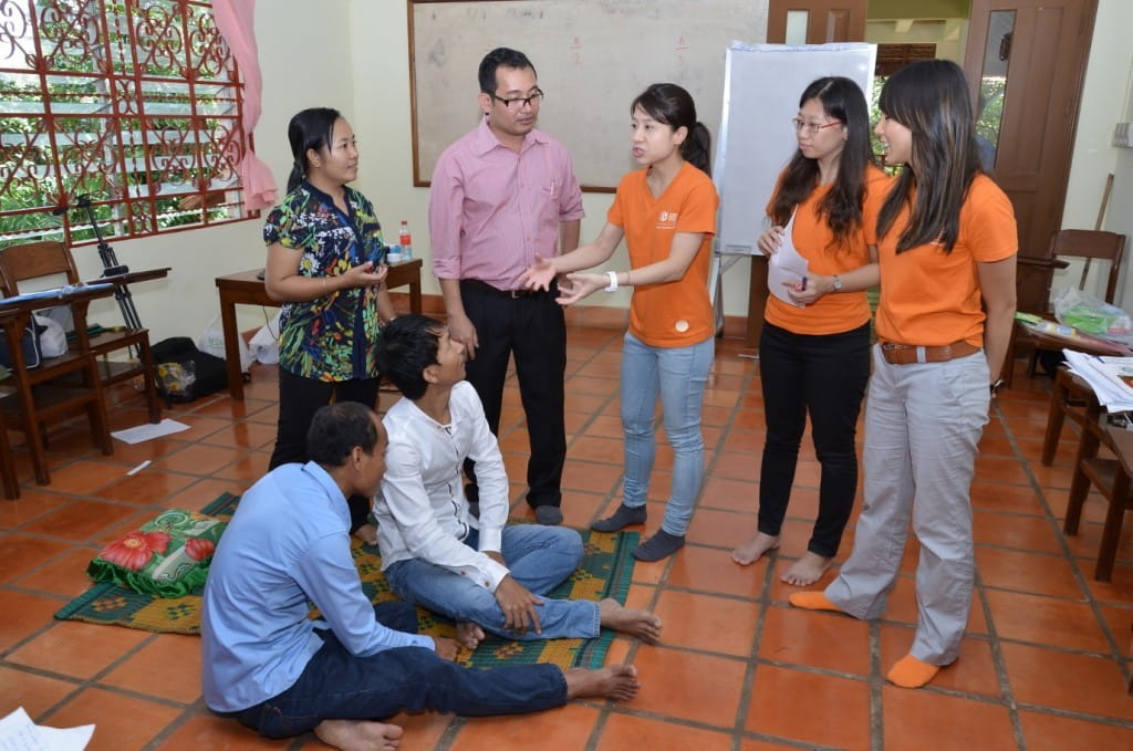 Speech therapy SIV team training their Cambodian counterparts in feeding and communication strategies for children.