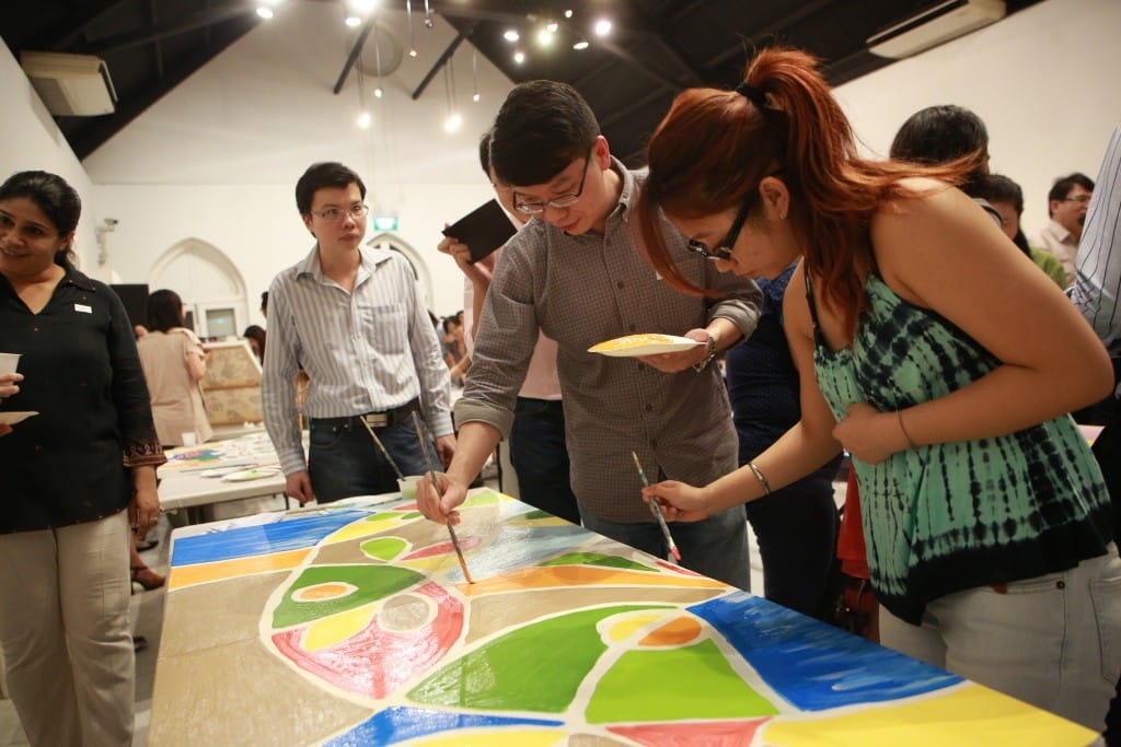 Participants putting the finishing touches to their painting as they enjoyed reconnecting with old friends and getting to know new ones during the networking night.