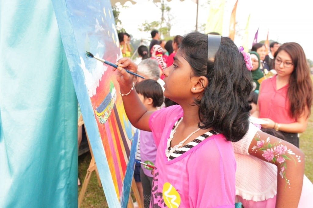 A participant at the ‘Everyday Action Live Canvas’ community art project at Gardens by the Bay.