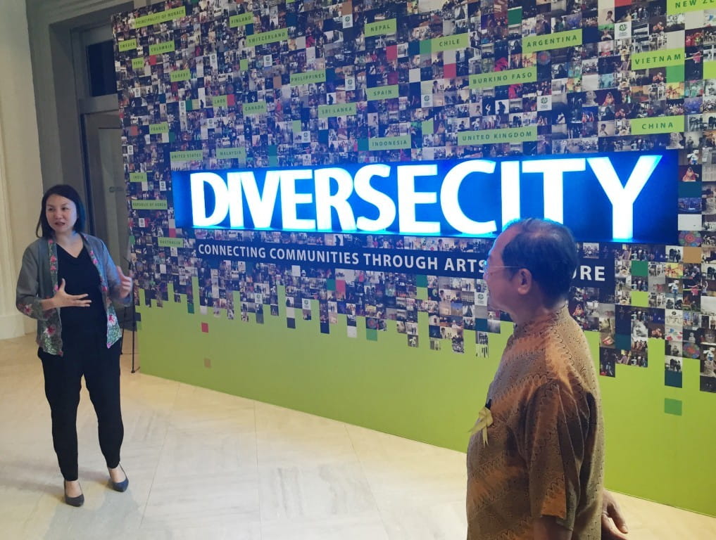 Art that Binds: SIF Deputy Director Ms Soh Lai Yee and citizen ambassador Dr Chua Soo Pong show the group around the SIF’s DiverseCity showcase.