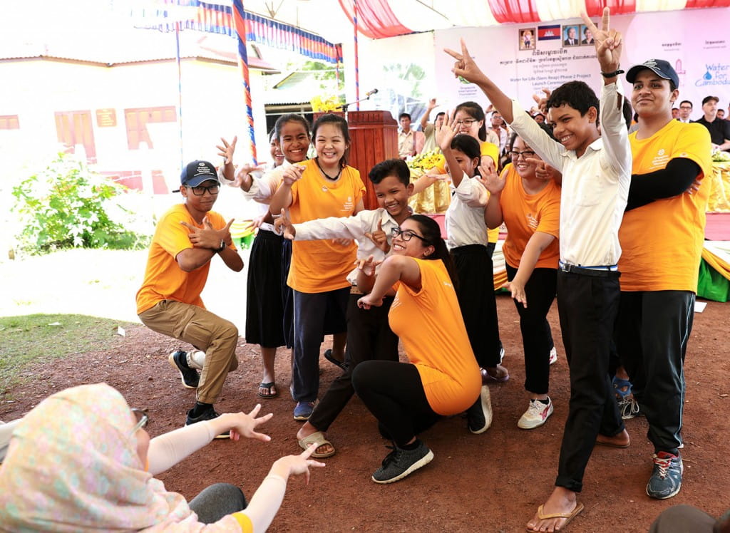 Singapore International Volunteers (SIVs) from Institute of Technical Education striking a pose with the local Cambodian school children after putting up a joint performance on hygiene training at the launch of the Water for Life (Siem Reap) Phase 2 Project. Over the next four years, over 240 volunteers from Singapore are expected to travel to Siem Reap to volunteer for the Water for Life project.