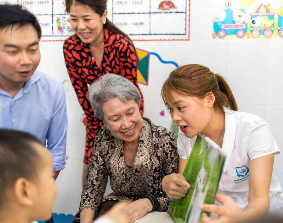 Mrs Lee Hsien Loong (seated, centre) visits a class for kids with special needs in Hanoi. This volunteer project is a collaboration between the SIF and National College for Education (NCE), aimed at raising the quality of special needs education in Vietnam.