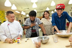 Chef Alberto Torres shows the students how to make scones.