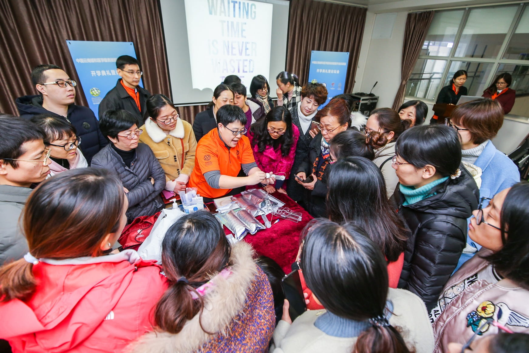 SIV from TTSH (in orange) shares practical tips with Chinese master trainers during a workshop.
